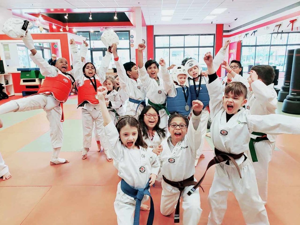 Kids lined up with their instructor at Dynamic Kick
